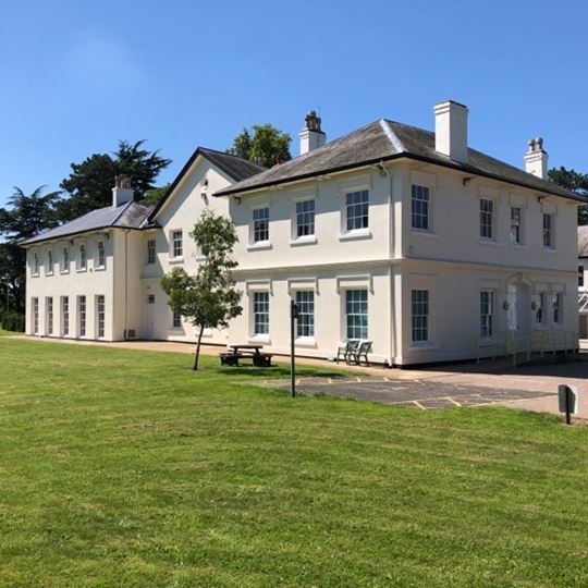 Easthorpe School building with picnic bench in the private grounds